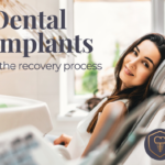 Woman sitting in dental chair slightly smiling. Dental implants and the recovery process.