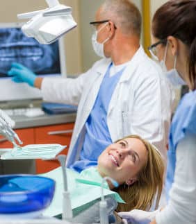 woman-in-chair-smiling-at-dental-assistant-without-dental-fear